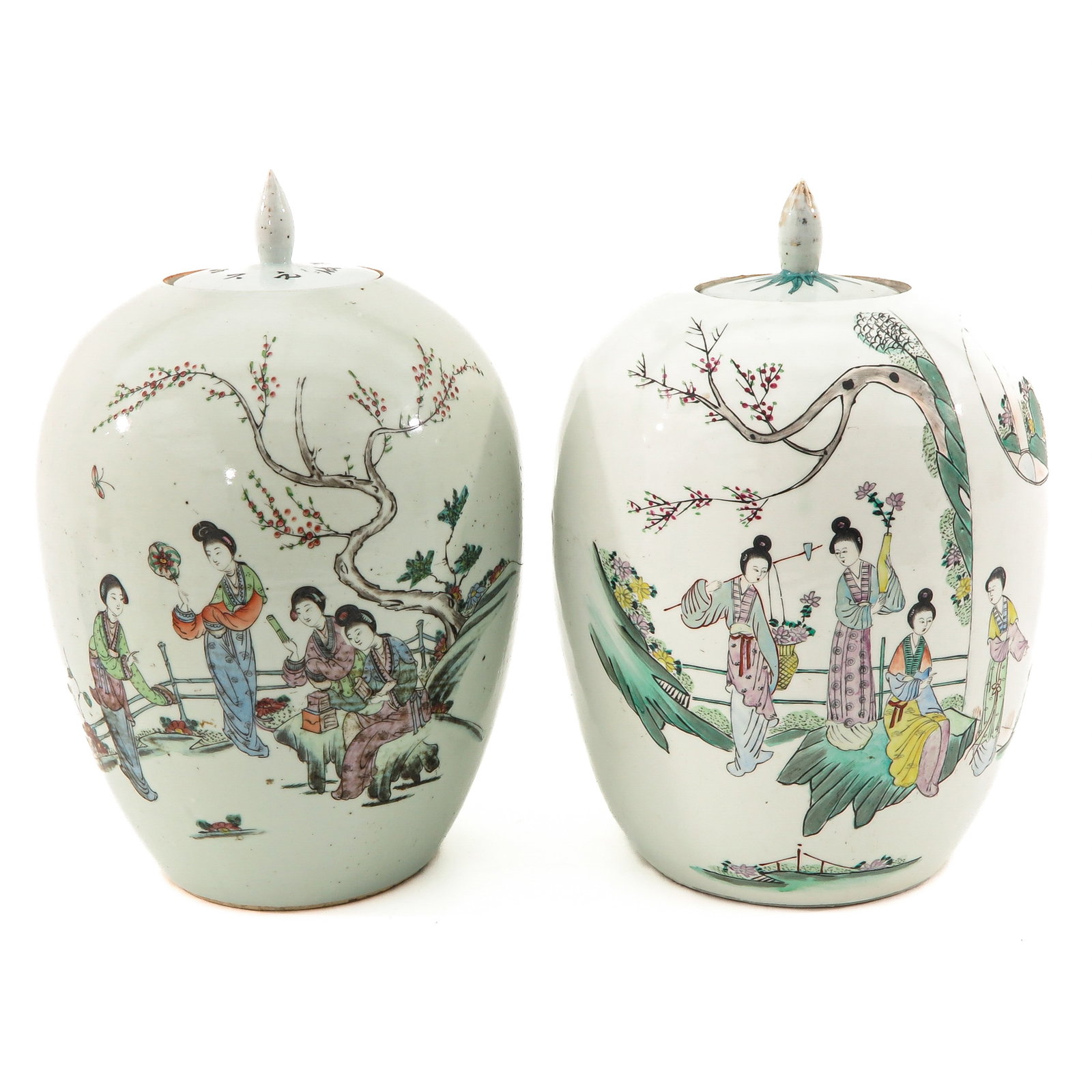 A Pair of Famille Rose Ginger Jars: Decorated with Chinese figures, 33 cm. tall, chip.