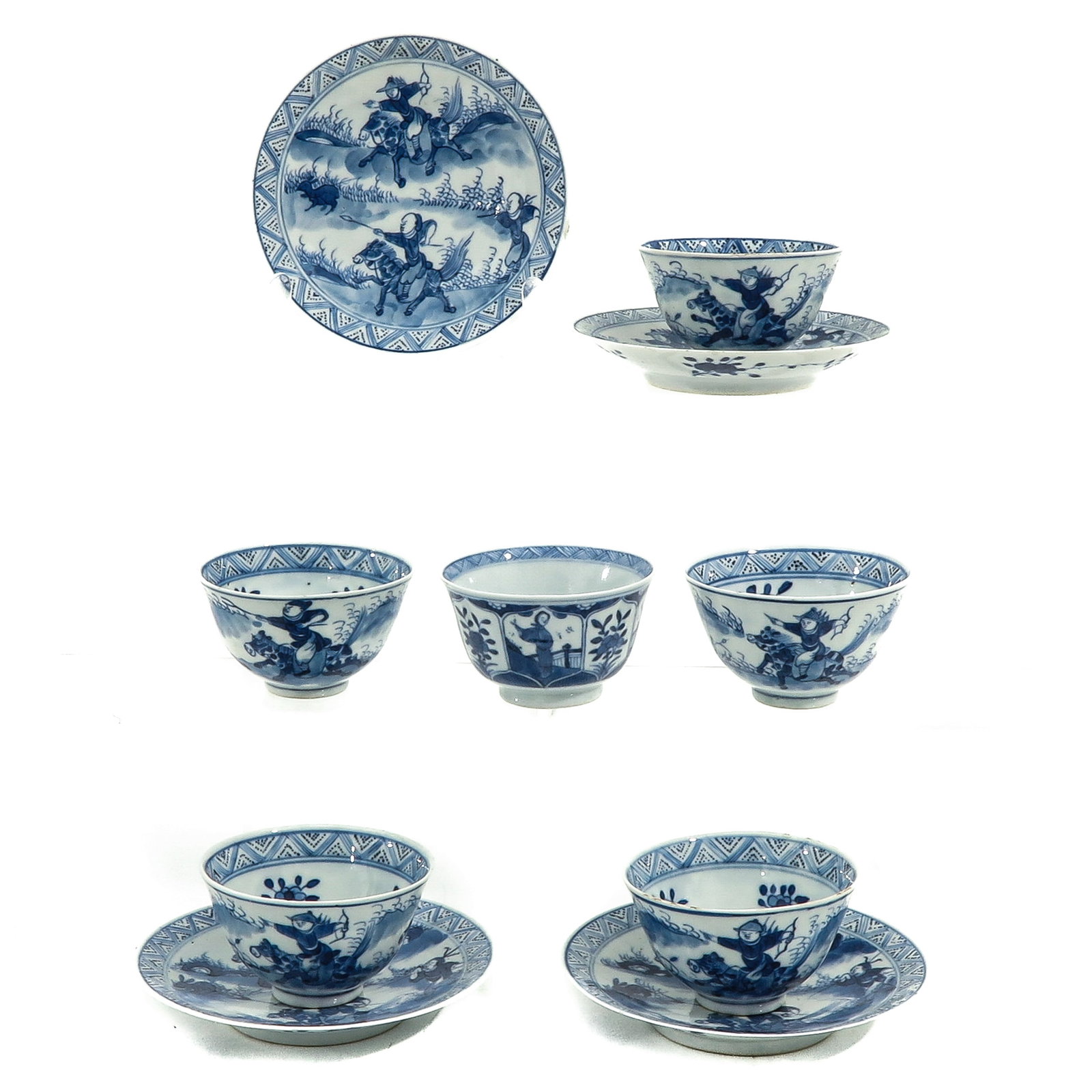A Collection of Cups and Saucers: Including 6 cups and 4 saucers, depicting Chinese hunters on horseback, Kangxi mark, saucers are 13 cm. in diameter, chip and hairline.