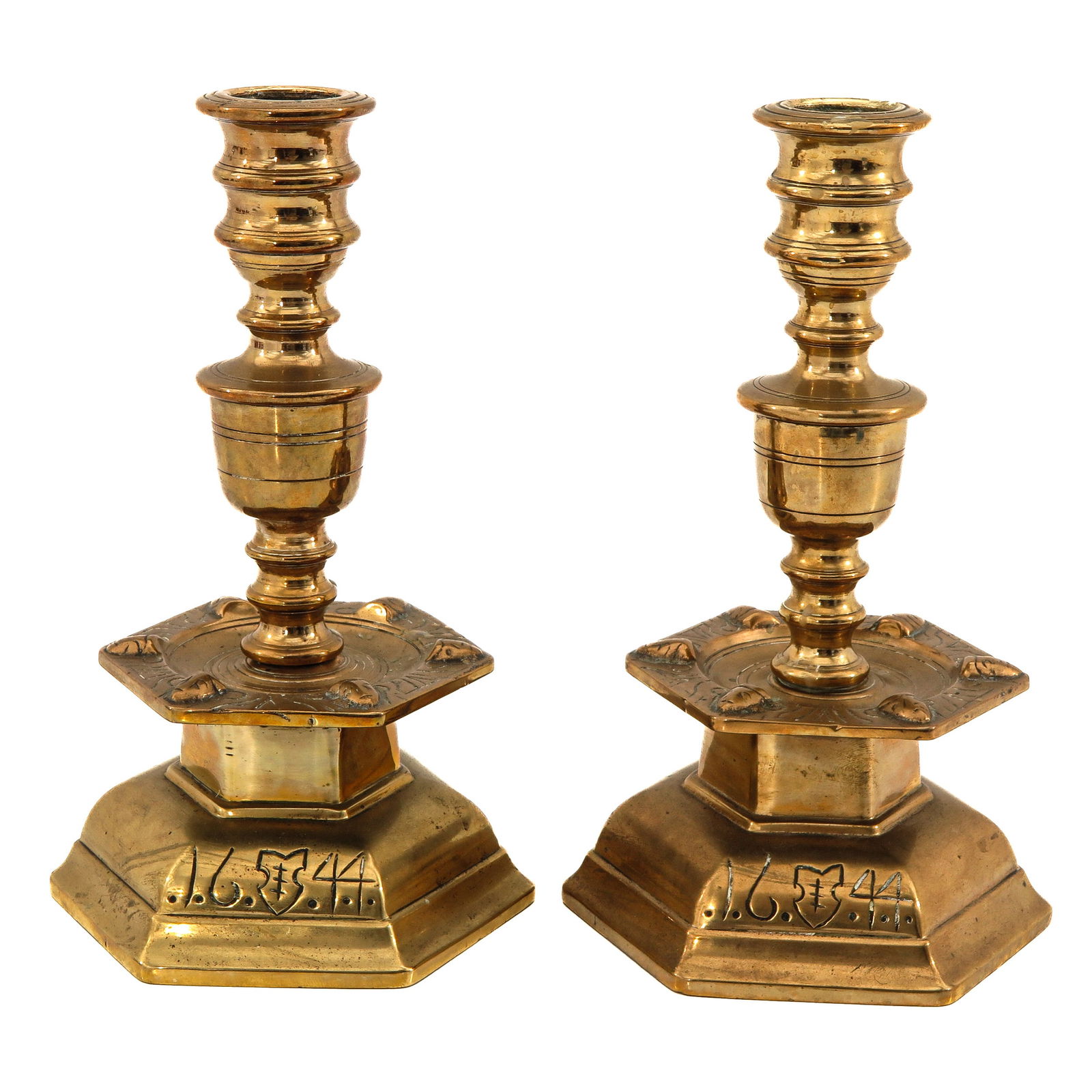 A Pair of Candlesticks: Dated 1644, bronze, height 22 cm.