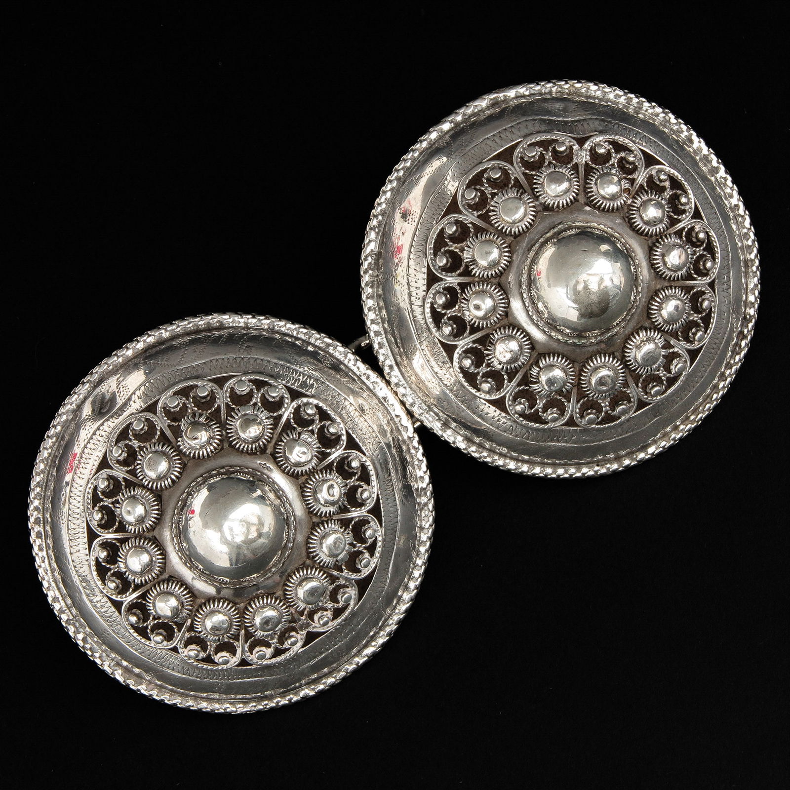 A Pair of Silver Dutch Broekstukken: Second grade, diameter, 6 cm.