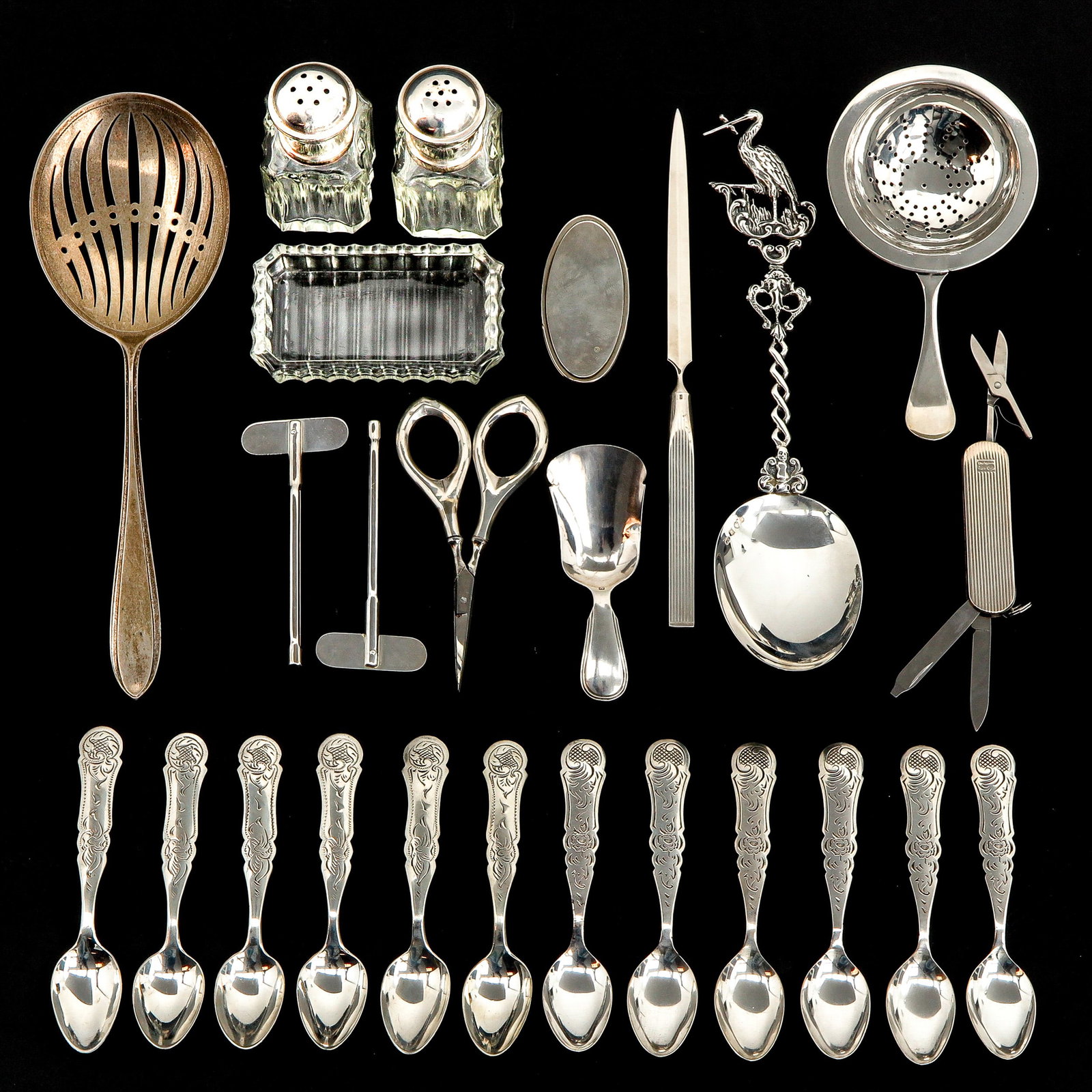 A Collection of 23 Pieces of Silver: Including a birth spoon with stork, 1st degree silver, maker's mark, H. Hooijkaas, Schoonhoven, length 21 cm.