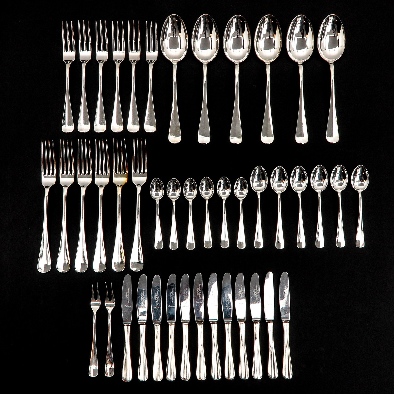 A Collection of 44 Pieces of Cutlery: Including spoons, forks and teaspoons, largest length 20 cm.