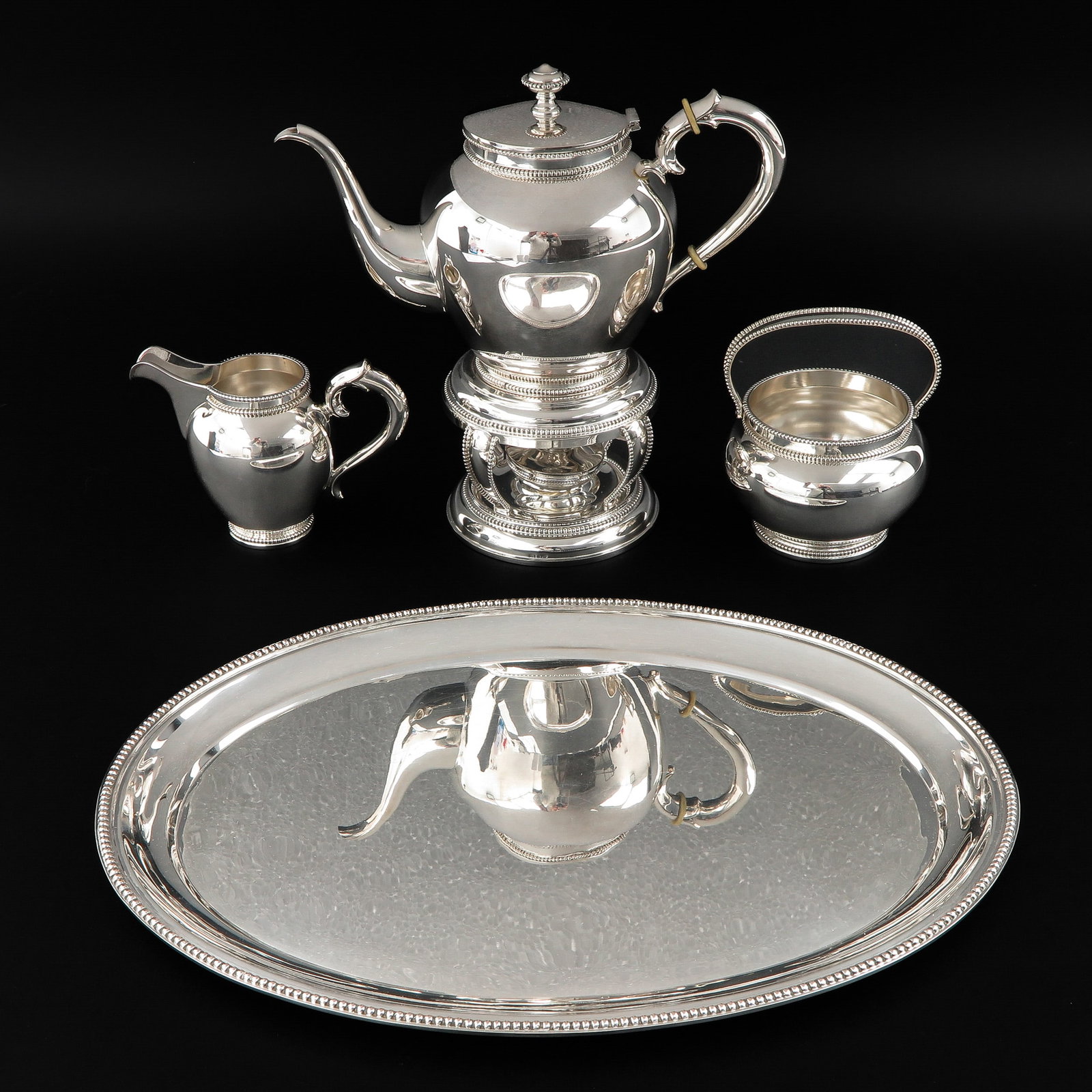 A Silver Tea Service: 835/1000, consisting of 5 pieces, including oval tray, length 37 cm.