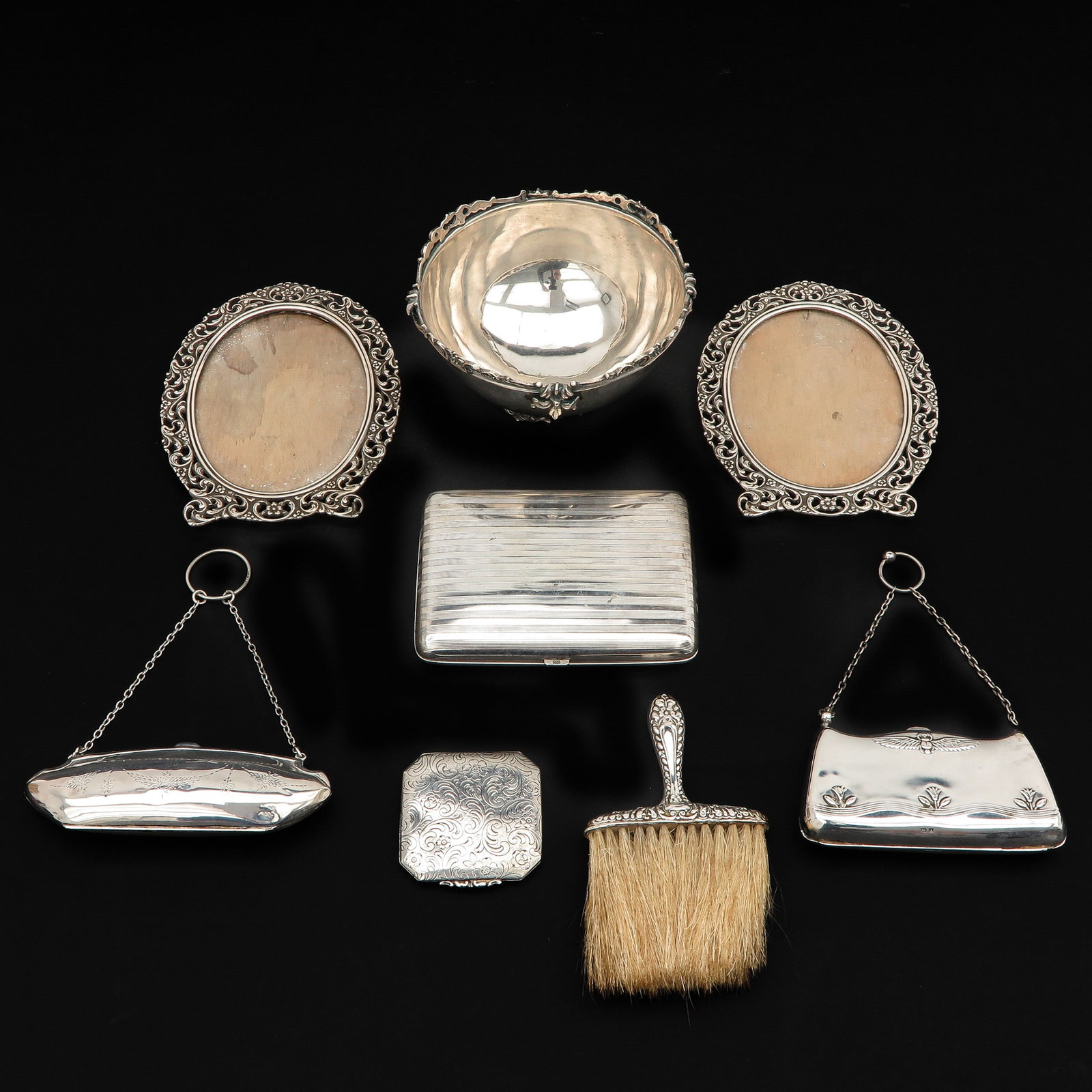 A Collection of 8 pieces of Silver: Including frames and cigarette box, length 13 cm.