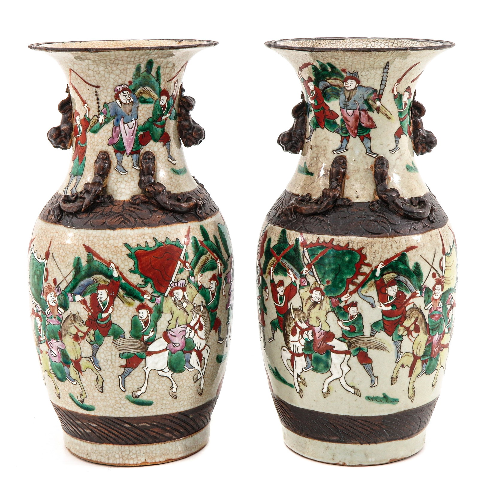 A Pair of Nanking Vases: Decorated with Chinese warriors on horseback, 35 cm. tall, chip.