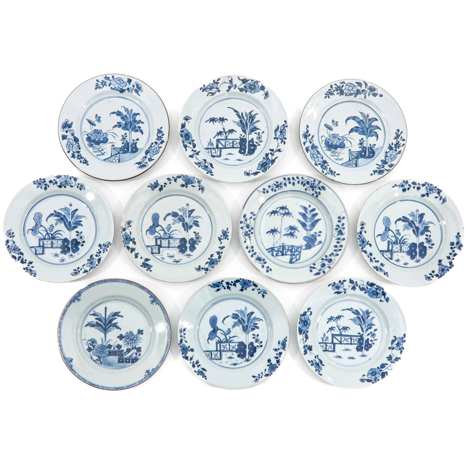 A Collection of 10 Plates: In a variety of blue and white decors, including 18th Century, 23 cm. in diameter, chip.
