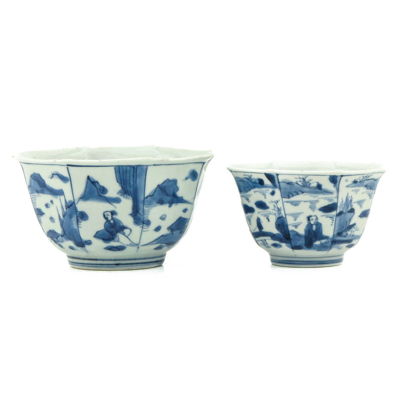 A Lot of 2 Blue and White Cups: Depicting scenes with landscapes and Chinese figures, 18th Century, largest cup is 11 cm. in diameter, chip and hairline.