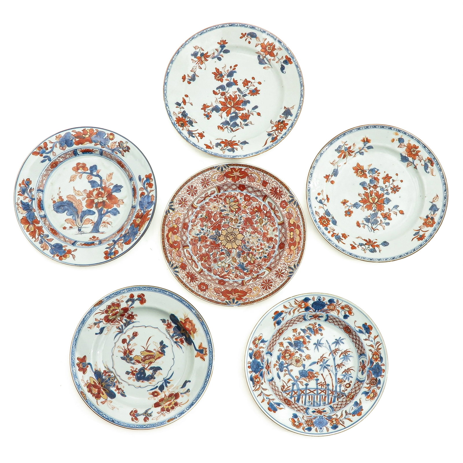 A Collection of 6 Imari Plates: In a variety of decors, 18th Century, 23 cm. in diameter, chip and hairline.