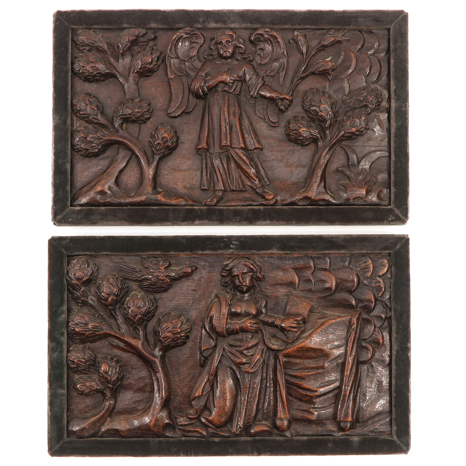 A Lot of 2 Carved Panels: Depicting the angel with the message, between deciduous trees and the Virgin Mary, kneeling at a lectern, between deciduous trees, Flemish, 17th century, 43 x 24 cm.
