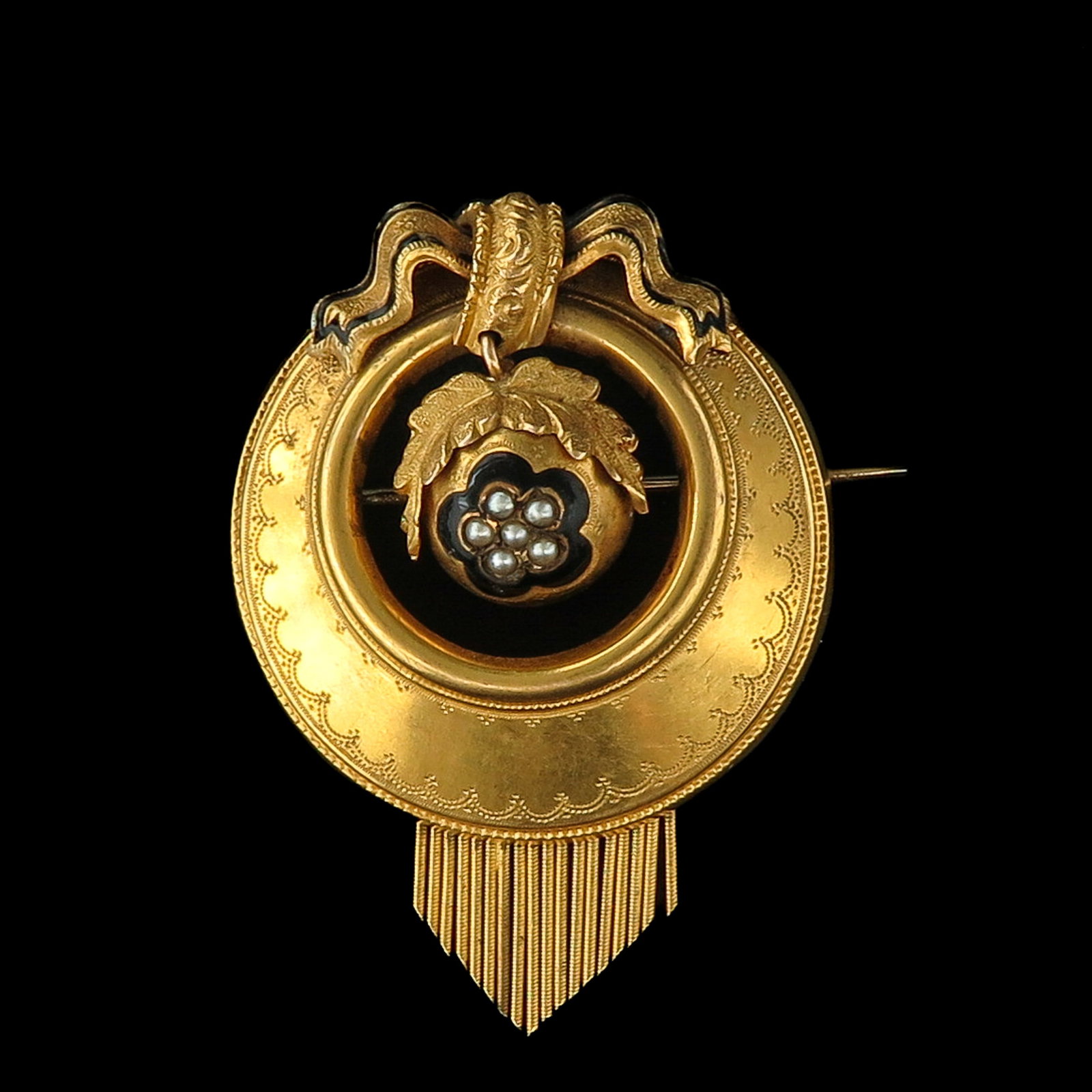 A Gold Brooch: Set with pearls in black enamel, length 45 mm.