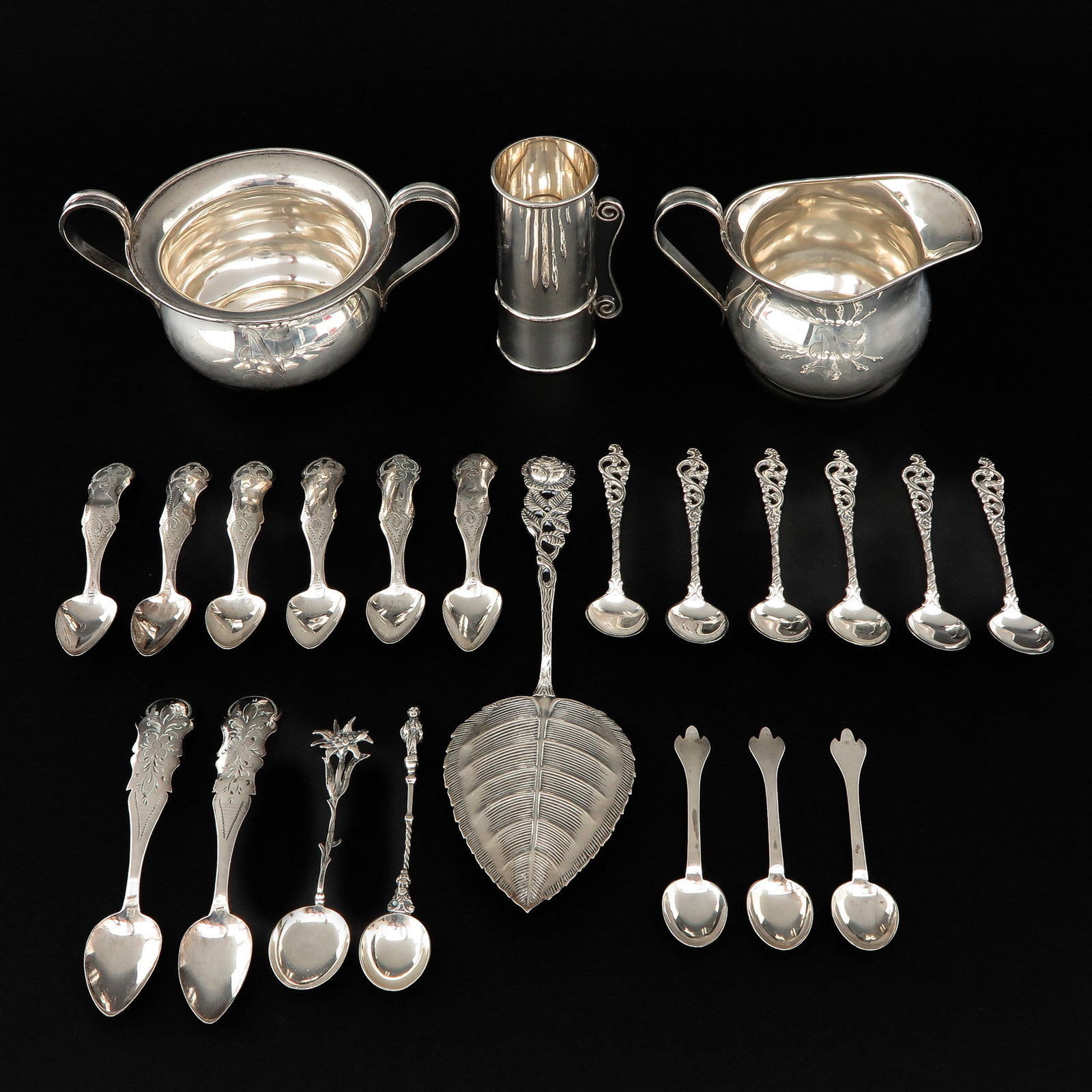 A Collection of Silver: Incl. sterling creamer and sugar bowl, height 8 cm.