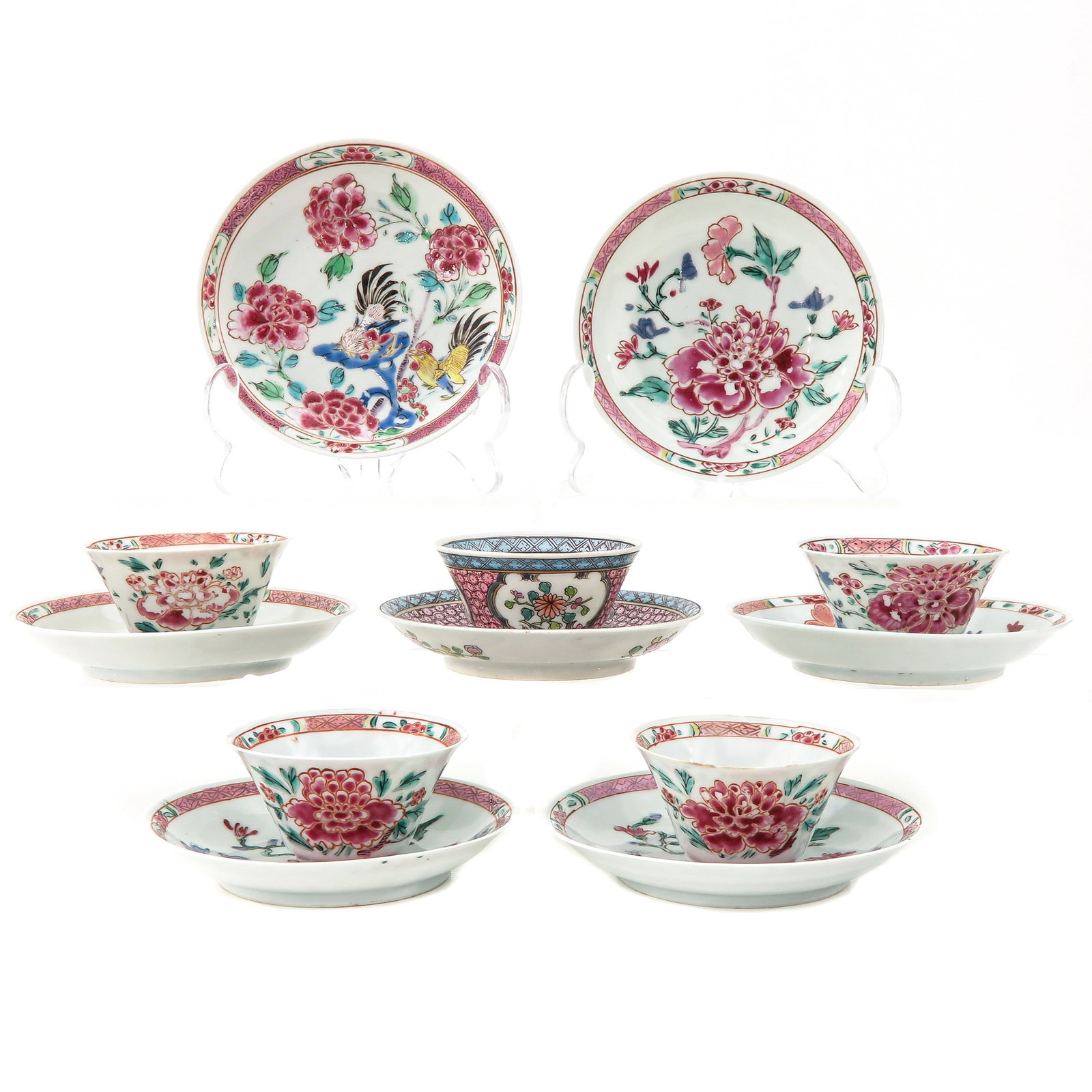 A Varied Collection of Cups and Saucers: In a variety of famille rose decors, including 18th Century, 5 cups and 7 saucers, largest saucer is 12 cm. in diameter, chip and hairline.