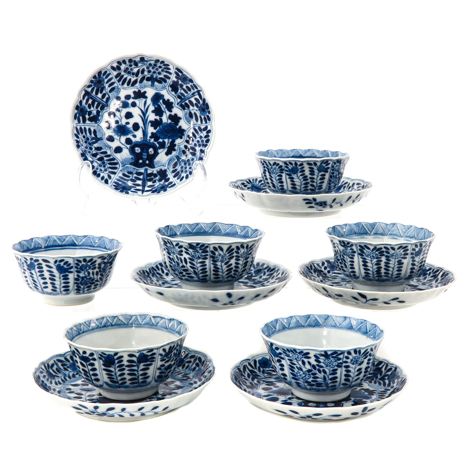 A Series of 6 Cups and Saucers: Depicting scene in garden with flowers and rocks, Kangxi mark, saucers are 12 cm. in diameter.