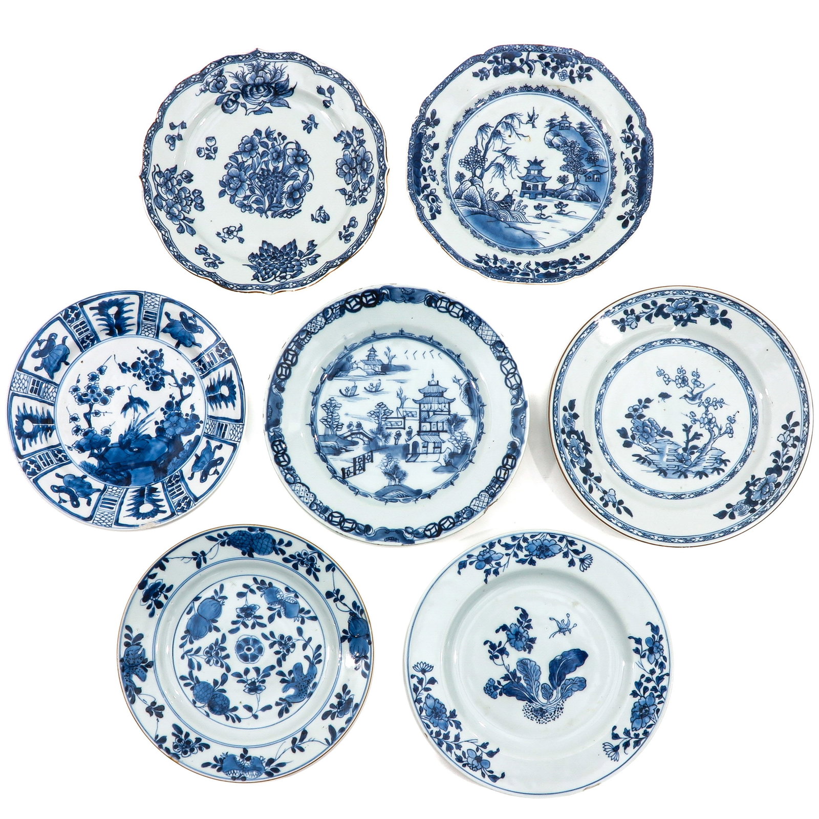 A Collection of 7 Plates: In a variety of blue and white decors, including 18th Century, largest plate is 23 cm. in diameter, in diverse conditions.