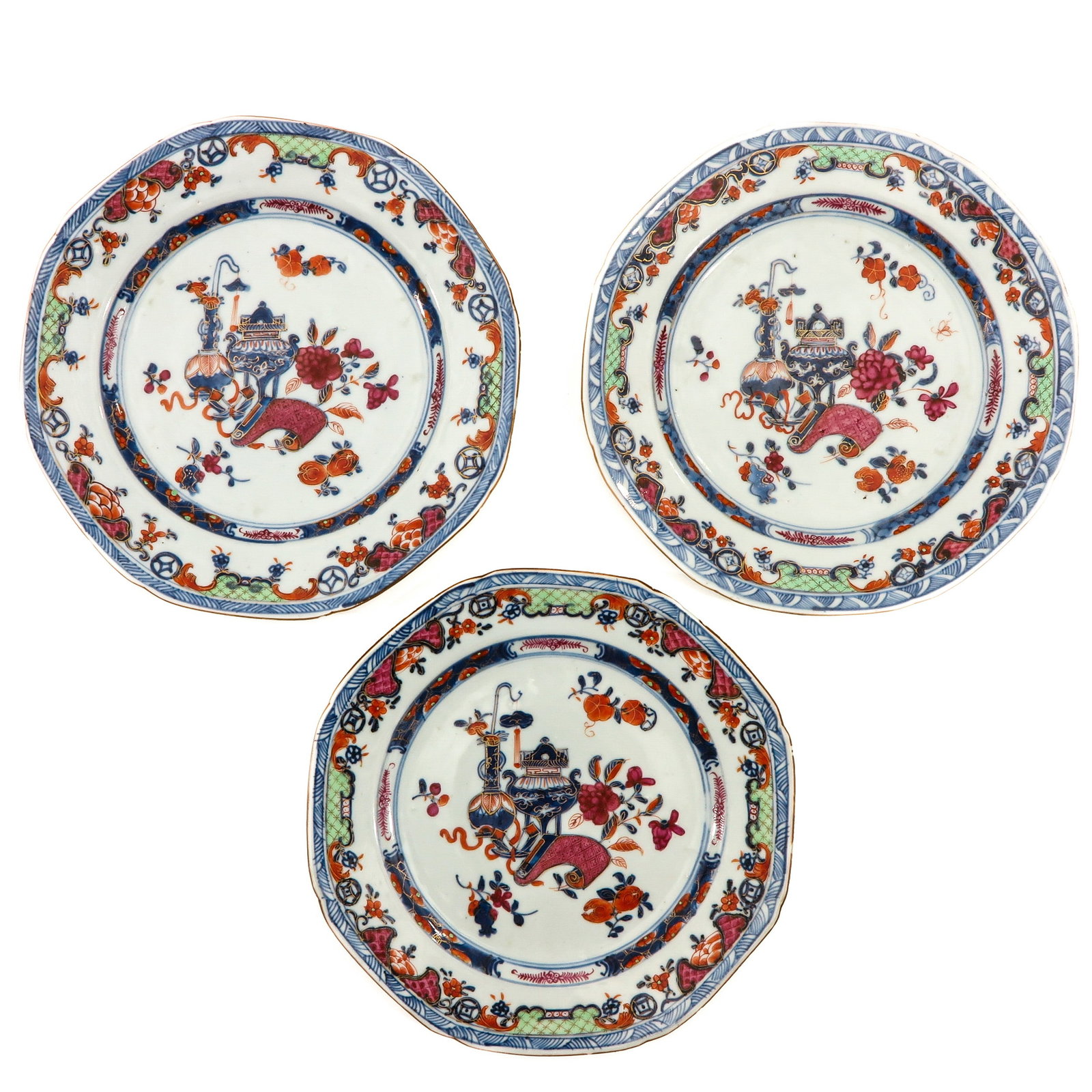 A Series of 3 Octagon Plates: Decorated with Chinese antiquities, Qianlong Period, 23 cm. in diameter, chip.