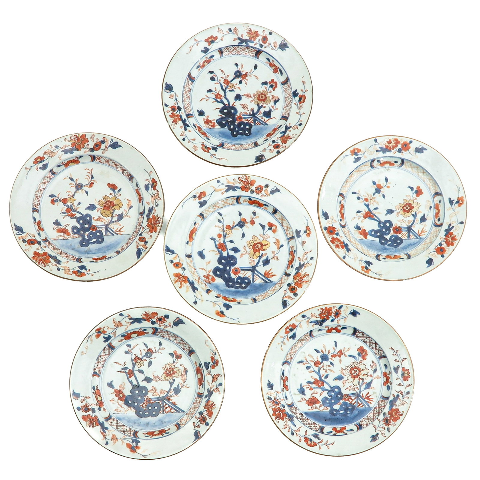 A Group of 6 Imari Plates: Depicting garden scene with flowers and rocks, 18th Century, 23 cm. in diameter, chip.