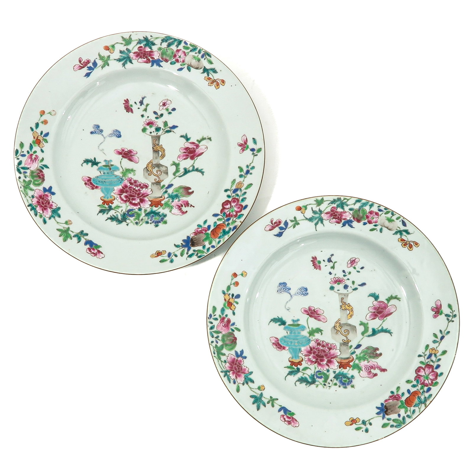 A Pair of Famille Rose Antiquities Chargers: Decorated with flowers and Chinese antiquities in center of chargers surrounded by floral border, 18th Century, 35 cm. in diameter.