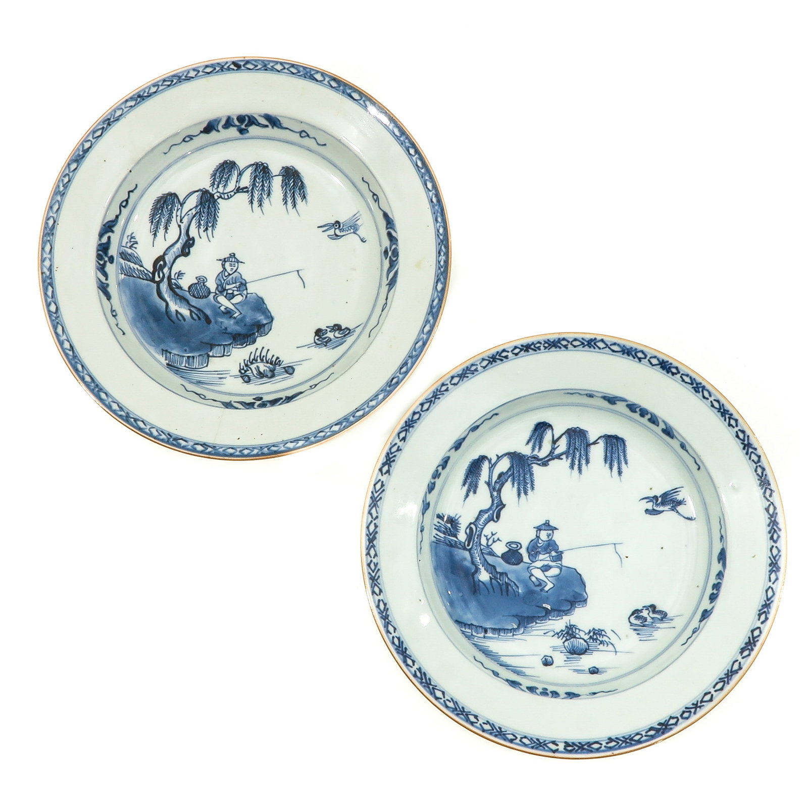 A Pair of Blue and White Plates: Fisherman decor, 18th Century, 23 cm. in diameter, hairline.