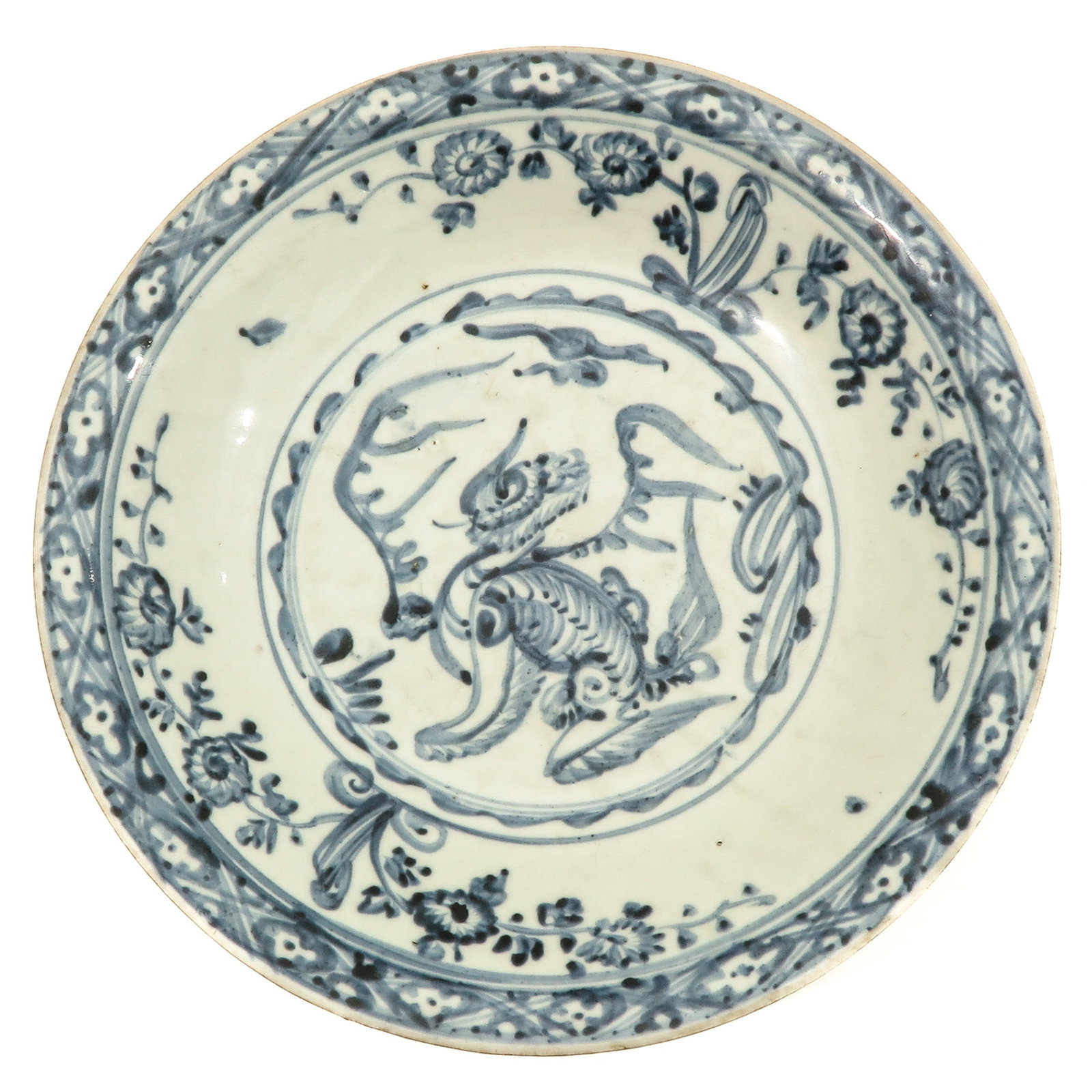 A Swatow Charger: 16th Century decorated with temple lion, 38 cm., fritting on edges.