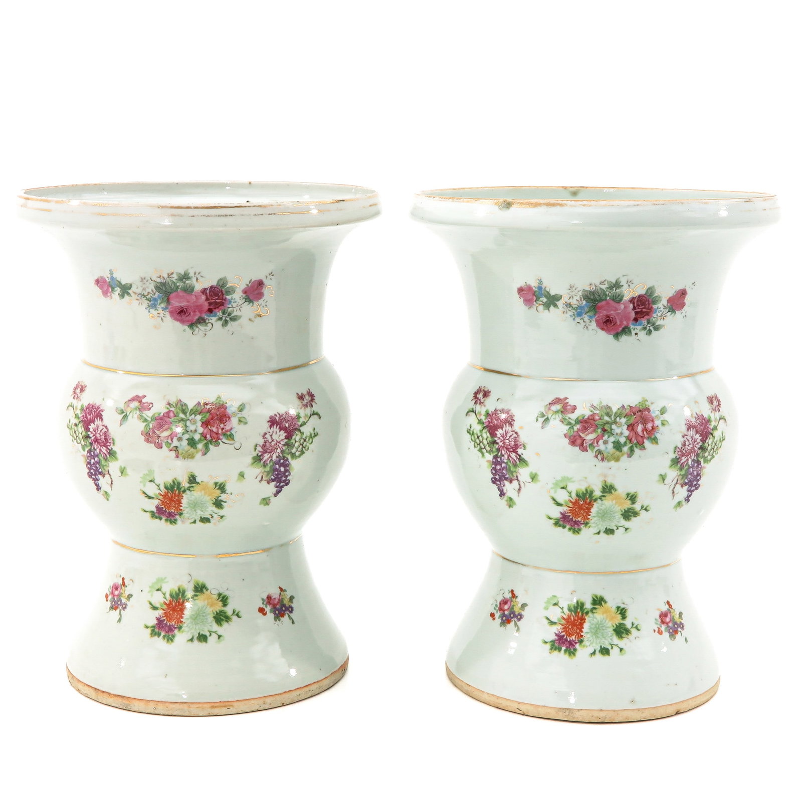 A Pair of Famille Rose Vases: Decorated with sprays of flowers and Chinese text, 31 cm. tall.