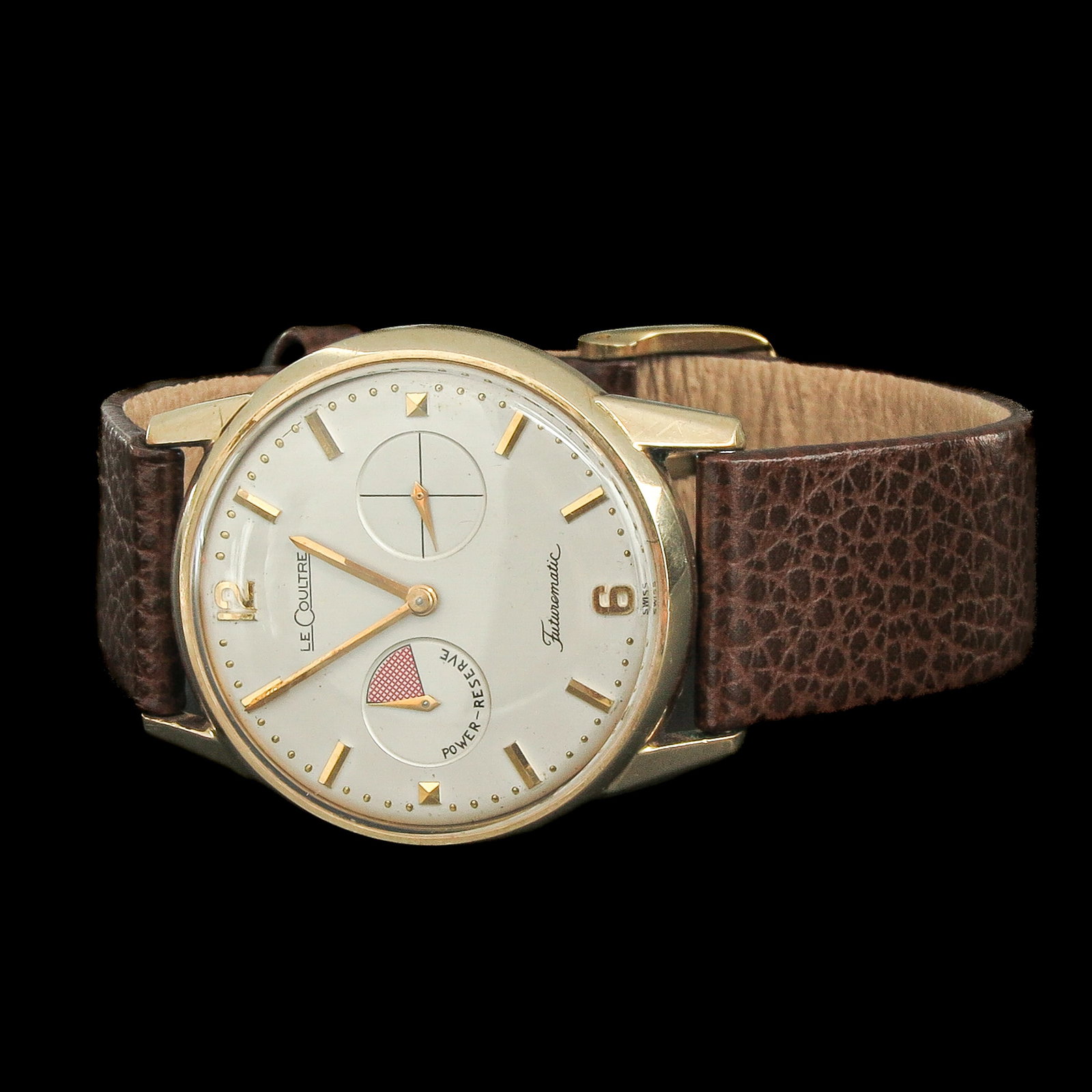 A Men's Watch: brand LeCoultre, model Futurematic, on leather strap, case diameter 35 mm.