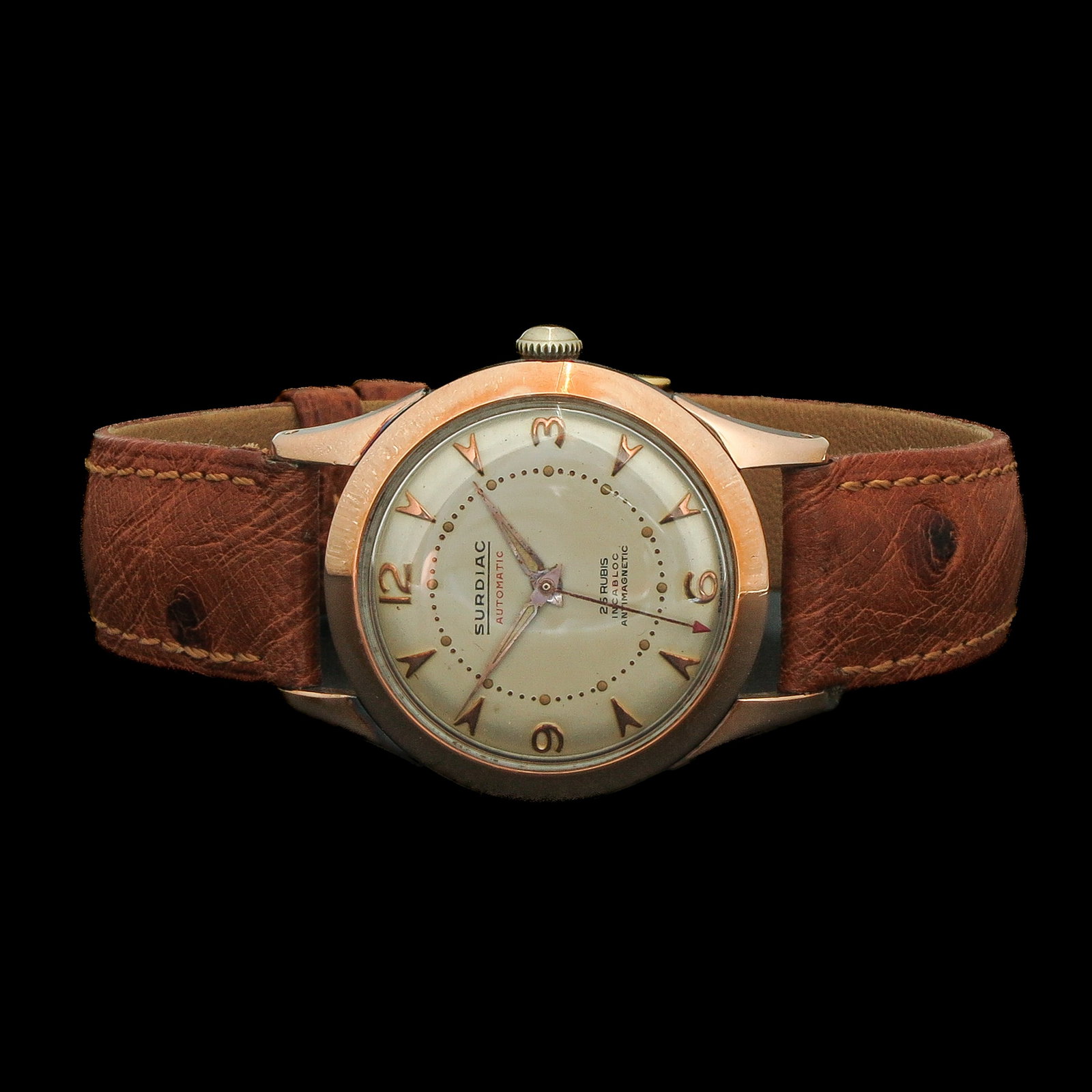 A Men's Watch: brand Surdiac, automatic, gold/steel, 50s, on leather strap, case diameter 33 mm.