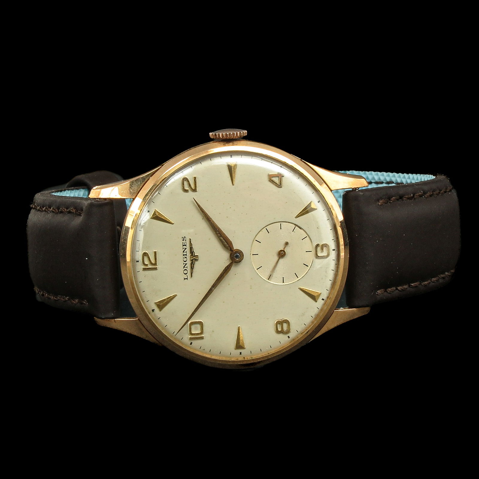 A Men's Watch: brand Longines, 18 carat gold, 1950, on leather strap, case diameter 35 mm.