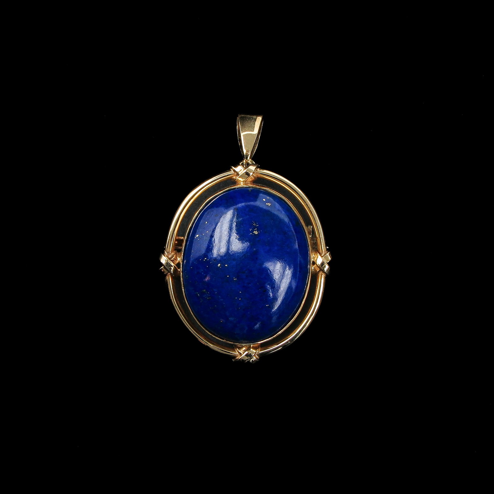 A Pendant: 14 carat gold, set with lapis lazuli, stone 23 x 20 mm.