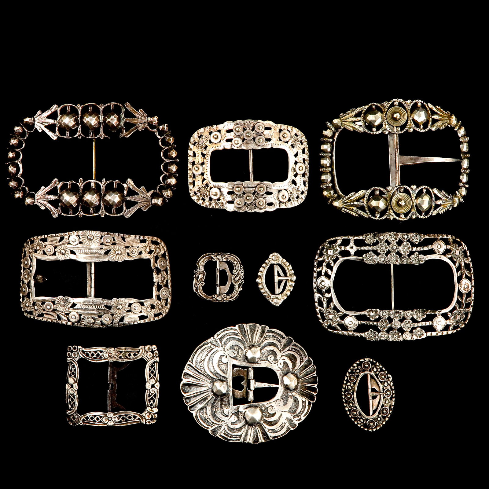A Collection of Silver: consisting of silver shoe buckles and various buckles, 18th and 19th century, longest 11 cm.