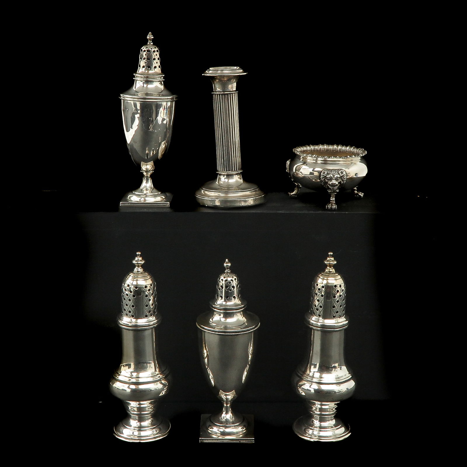 A Diverse Collection of Silver: silver, consisting of sugar shakers, candlestick and salt cellar, diameter 9 cm.
