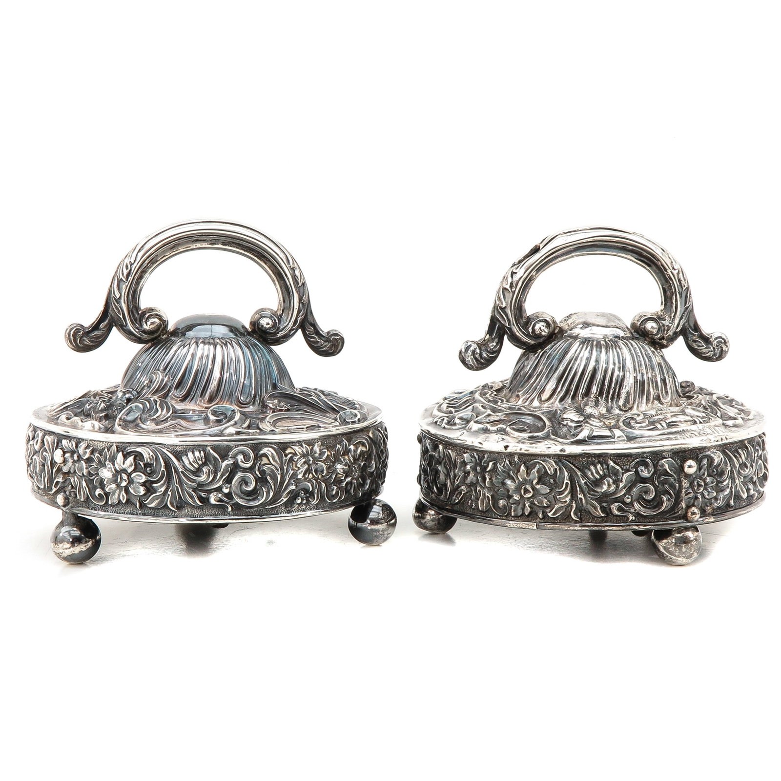 A Pair of Altar Bells: silver altar bells, floral decoration, diameter 20 cm.