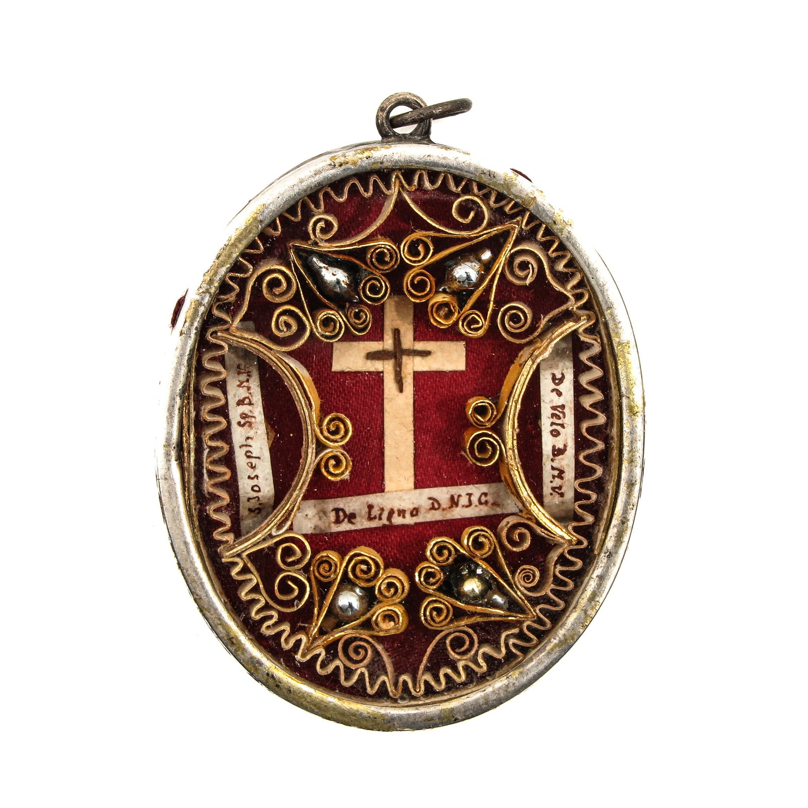 A Reliquary: containing relic of the Holy Cross, BMV and Saint Joseph, length 7 cm.