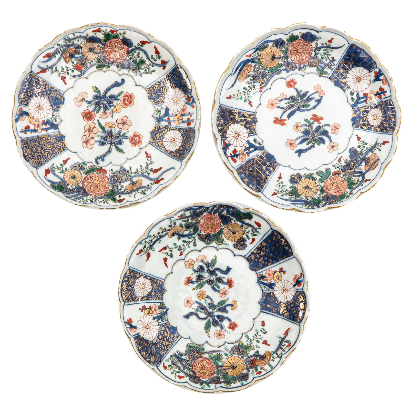 A Series of 3 Plates: Floral decor in polychrome enamels, 18 cm. in diameter, fritting.
