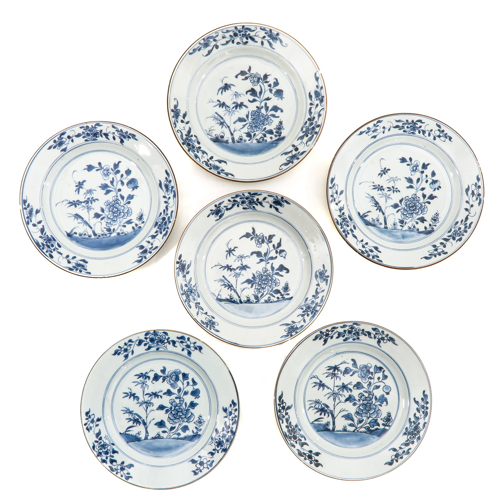 A Series of 6 Blue and White Plates: Depicting a scene in garden with flowers and bamboo, 18th Century, 23 cm. in diameter,