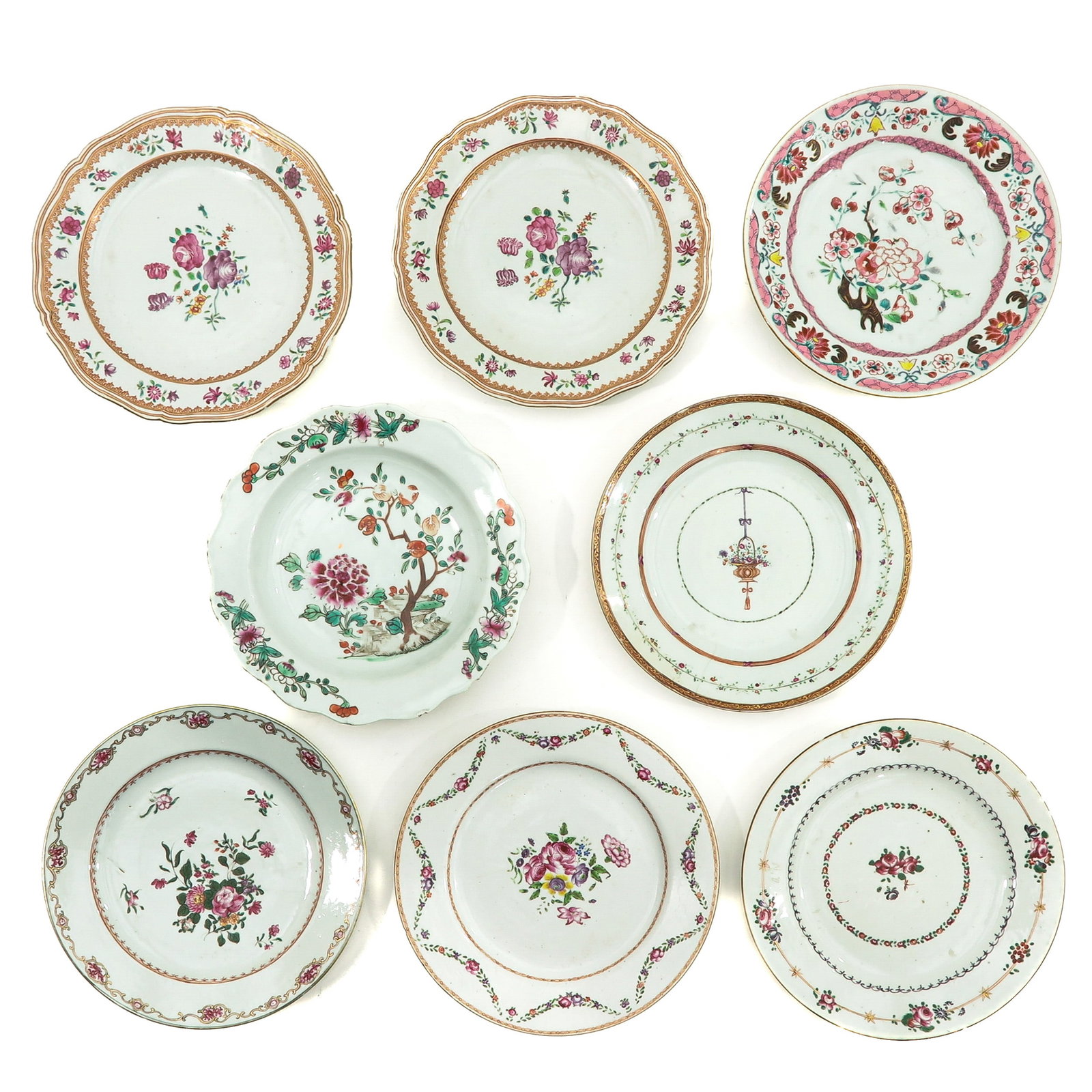 A Collection of 8 Famille Plates: Including 18th Century, largest plate is 23 cm. in diameter, chip and hairline.