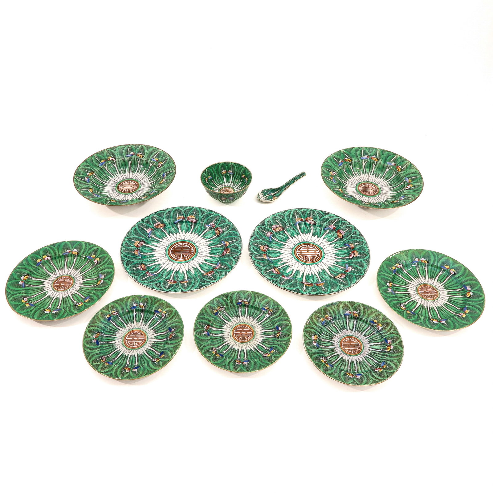 A Collection of Cabbage Leaf Famille Verte Porcelain: 11 pieces, decorated with sign of longevity and butterflies, 19th Century, largest plate is 27 cm. in diameter.