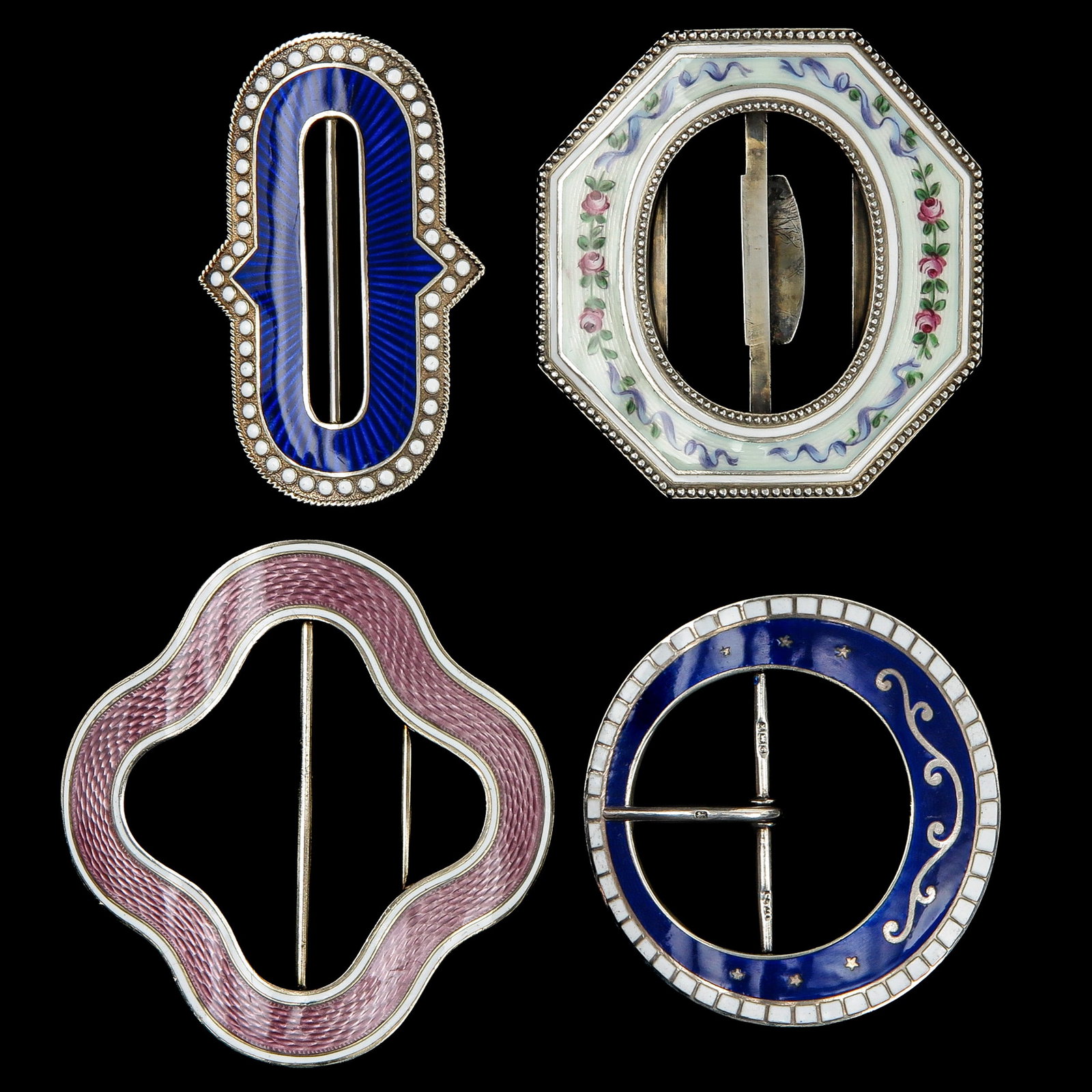 An Assortment of Silver Guilloché Buckles: consisting of 4 silver Guilloché enamelling buckles, including Germany, Birmingham, and Norway, longest 71 mm.
