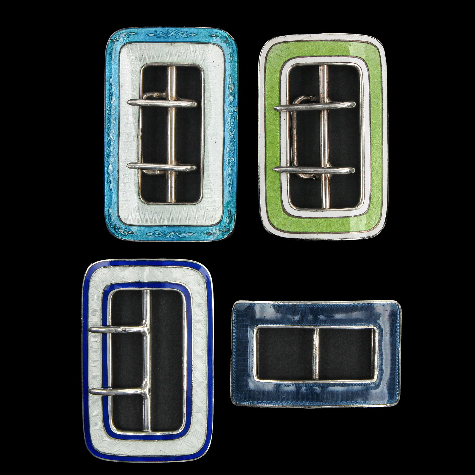An Assortment of Silver Guilloché Buckles: consisting of 4 silver Guilloché enamelling buckles, including Germany, and Birmingham, longest 68 mm.