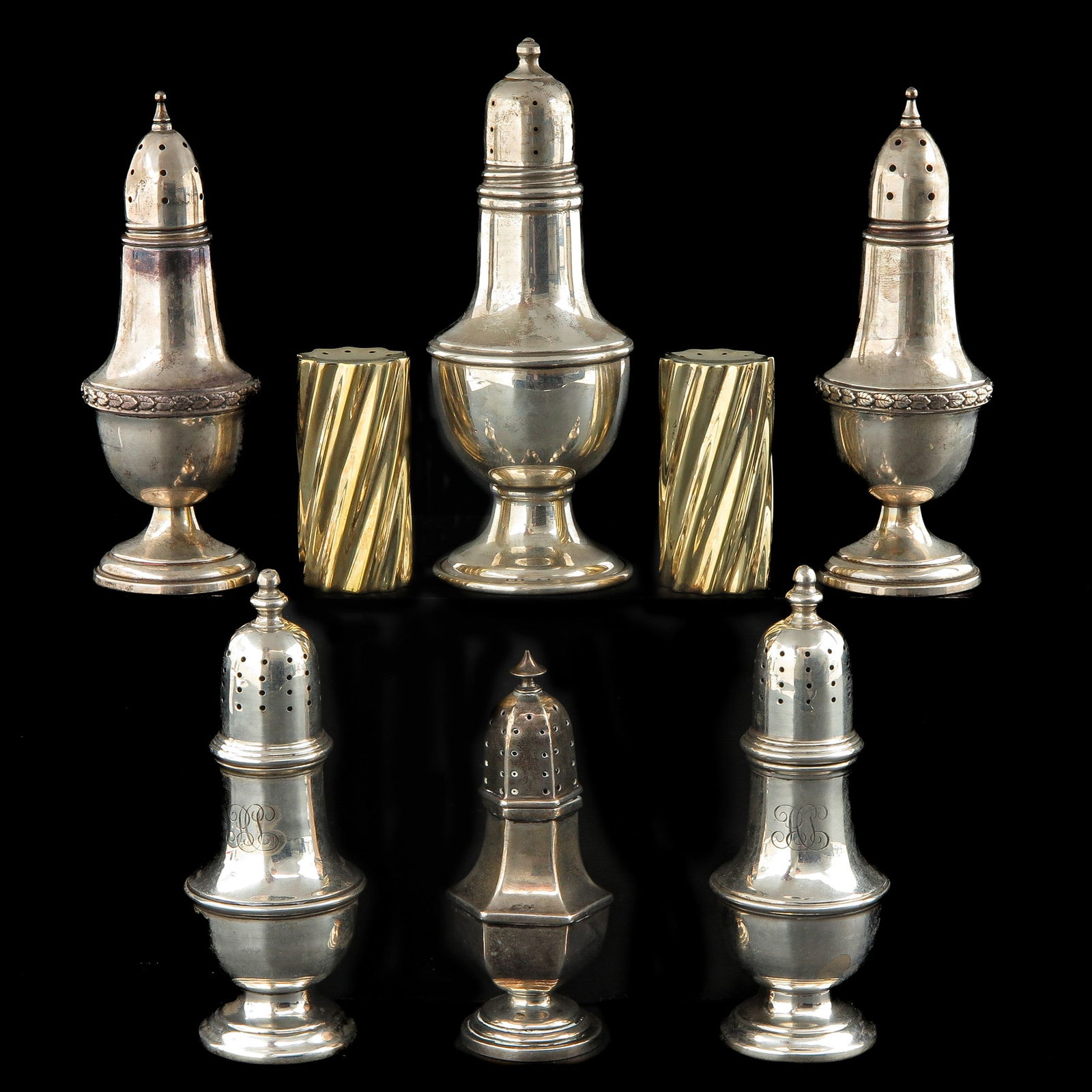 A Collection of 8 Silver Castors: consisting of 8 silver shakers, highest 13 cm.