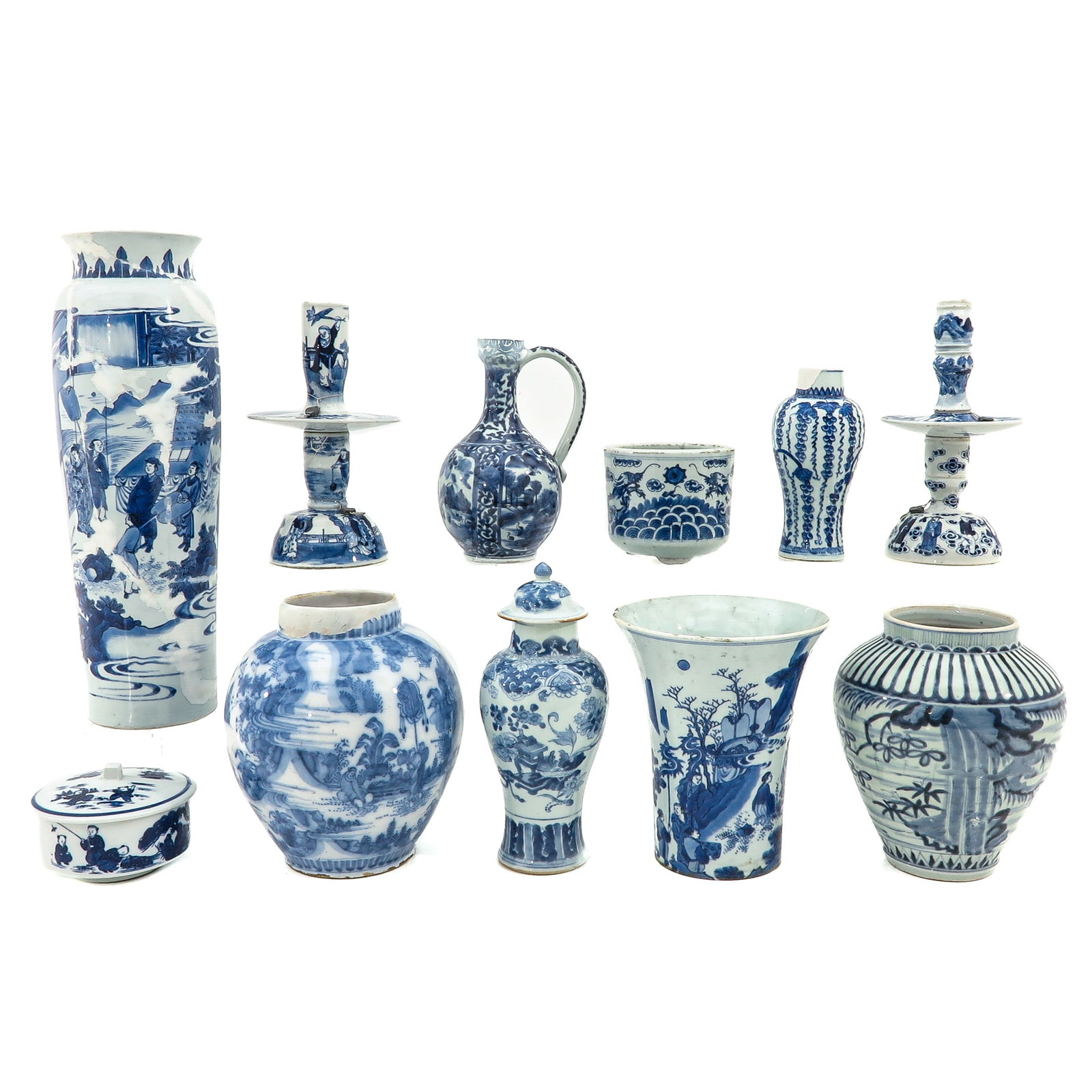A Collection of Blue and White Porcelain: 11 pieces, including Transitional Period sleeve vase, 47 cm. tall, in diverse conditions.