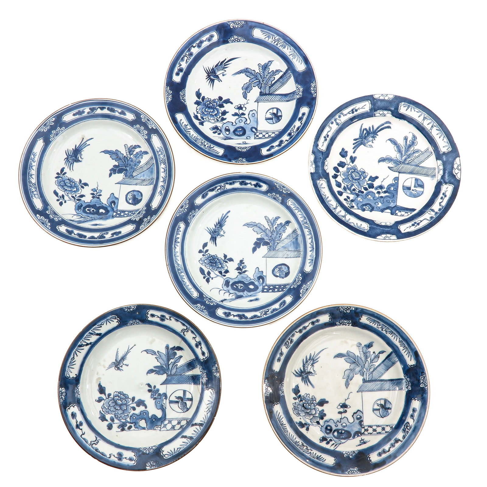 A Series of 6 Blue and White Cuckoo Plates: Depicting a garden scene with 2 cuckoo birds, 18th Century 23 cm. in diameter, in diverse conditions.