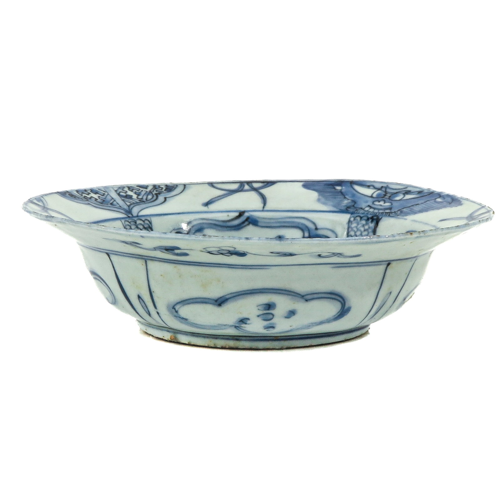 A Wanli Period Bowl: Decorated with Chinese figures in center of bowl, surrounded by flowers and fruit, 22 cm. in diameter, restoration on rim.
