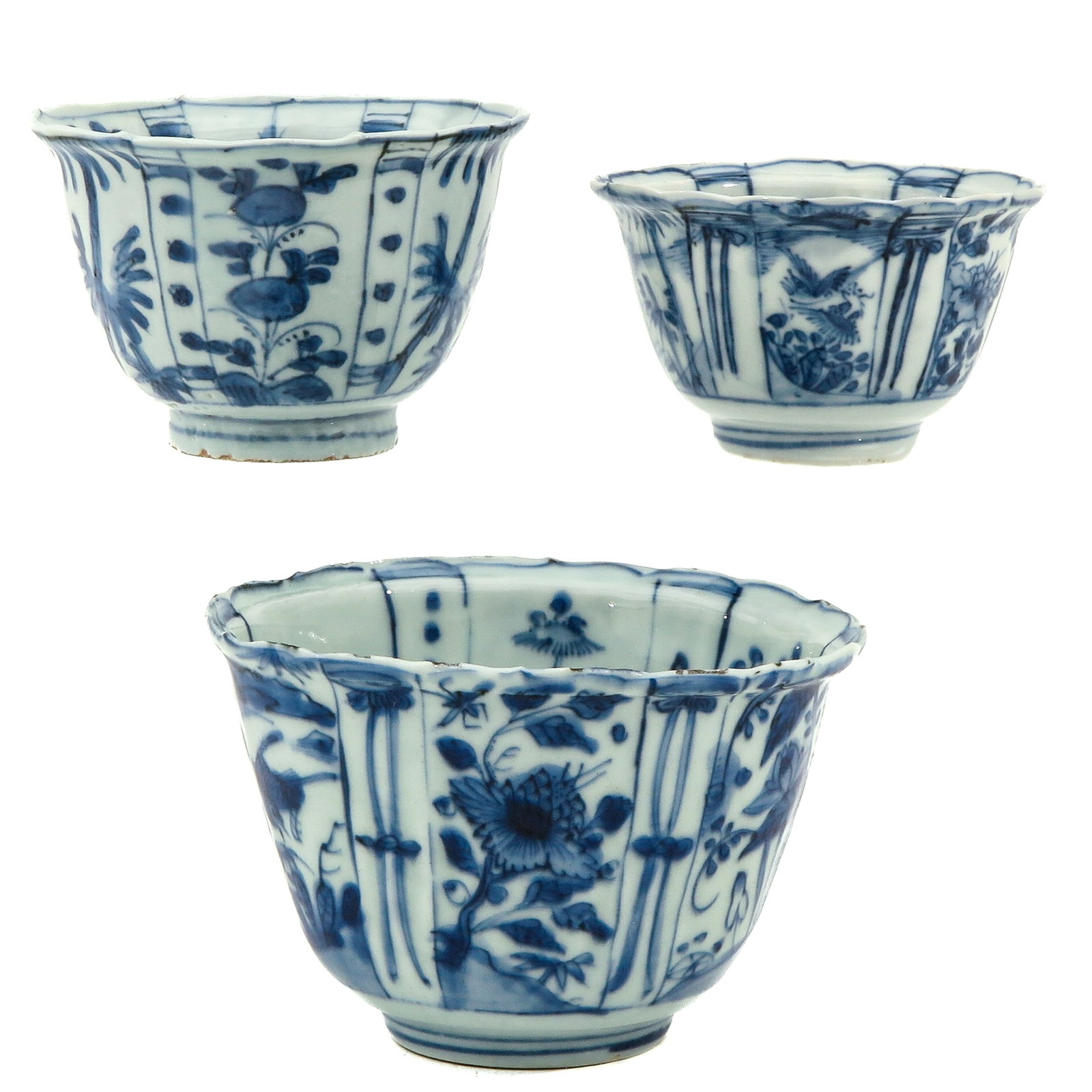 A Collection of Wanli Period Porcelain: Including 3 cups, decorated with flowers and birds, Wanli Period, largest cup measures 12 cm. in diameter, fritting.