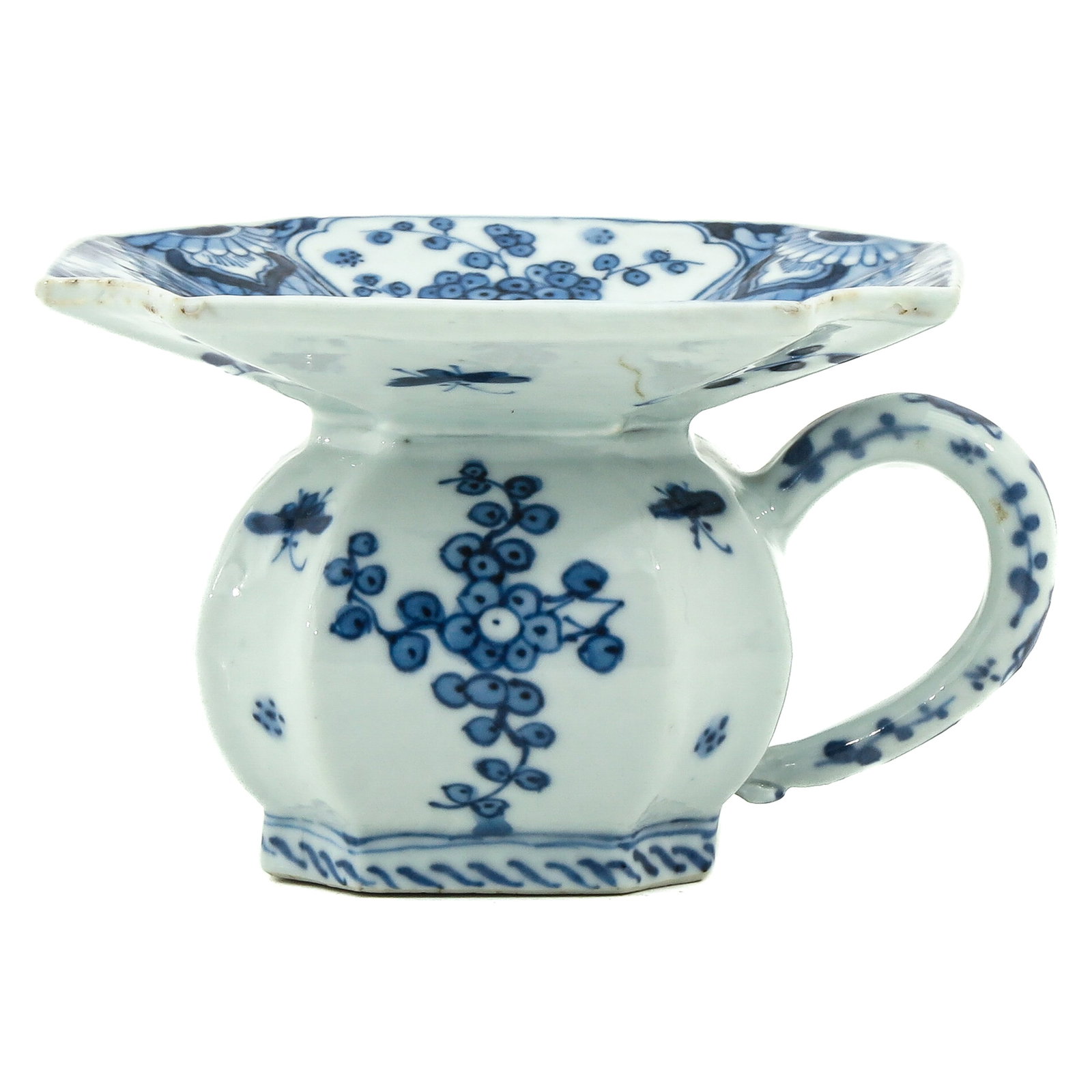 A Blue and White Spitoon: Decorated with scenes of flowers and landscapes, Kangxi Period, 8 cm. tall., fritting.