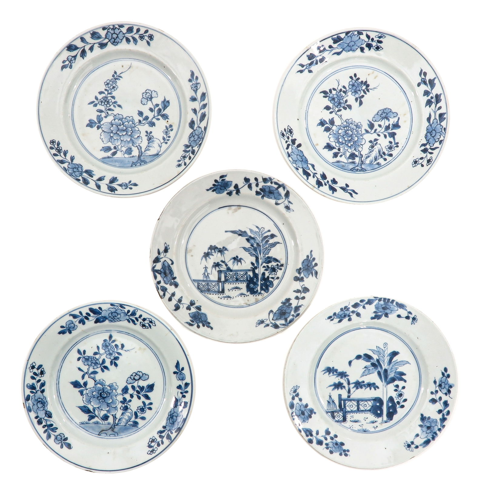 A Collection of 5 Blue and White Plates: In a variety of decors, 18th Century, 24 cm. in diameter, chip and hairline.