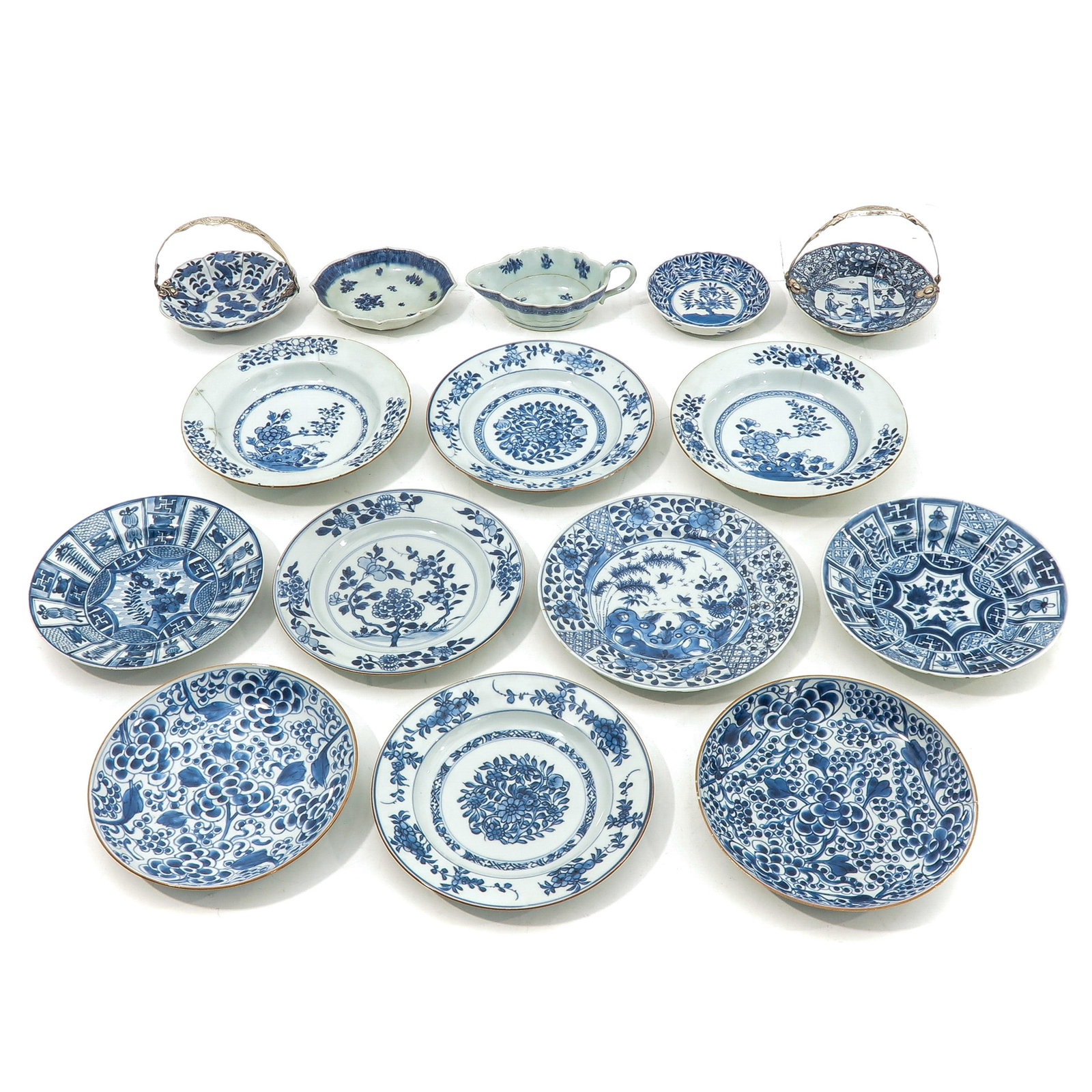 A Collection of Porcelain: A variety of items including plates and gravy boat, some 18th Century, gravy boat is 19 cm. long, in diverse conditions.