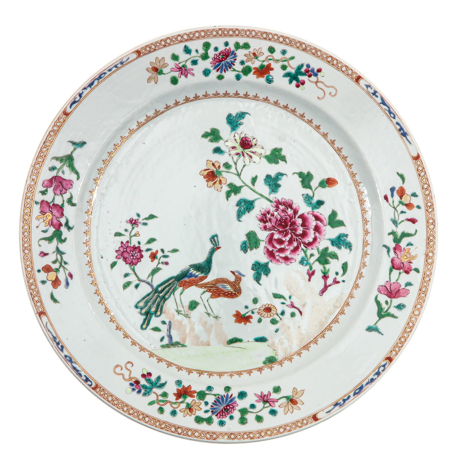 A Famille Rose Charger: Decorated with peacocks and peonies, 18th Century, 42 cm. in diameter, chip.