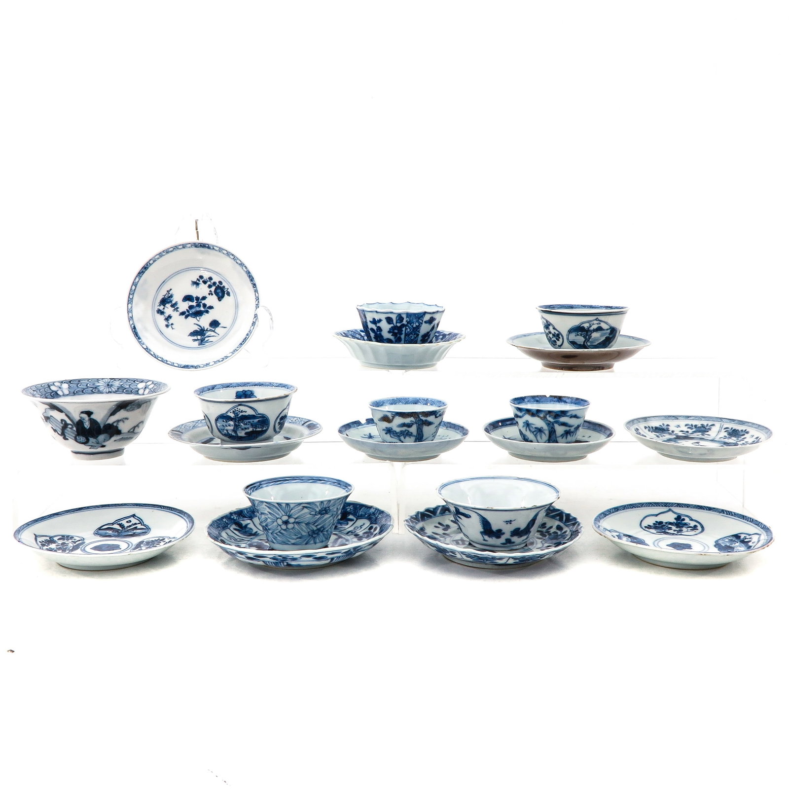 A Collection of Cups and Saucers: In a variety of decors, including 18th Century, largest saucer is 13 cm. in diameter, in diverse conditions.