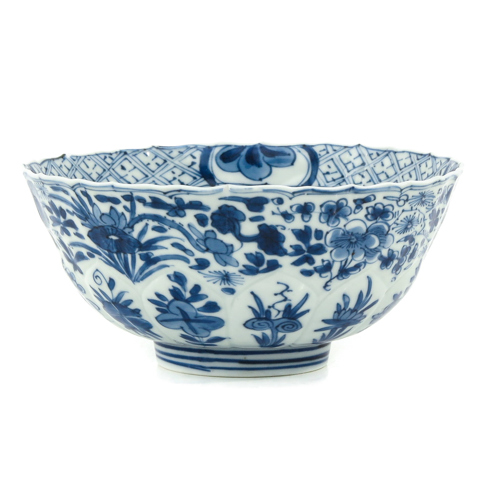 A Blue and White Bowl: Floral decor, 18th Century, 16 cm. in diameter, small restoration on rim.