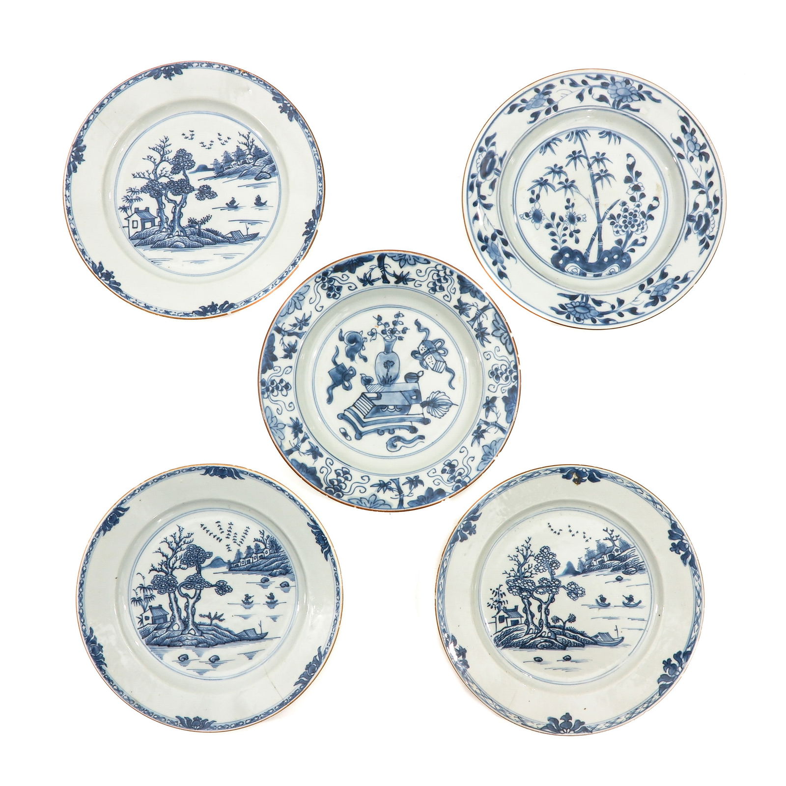 A Collection of 5 Blue and White Plates: In a variety of decors, 18th Century, 23 cm. in diameter, chip and hairline.
